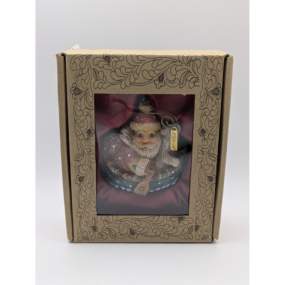 G.DEBREKHT ARTISTIC STUDIOS 2016 Hand Crafted Wood Ornament Santa On Canoe 63137